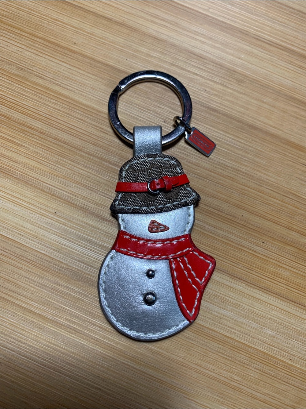 Coach Silver Snowman Keychain with Red Accents